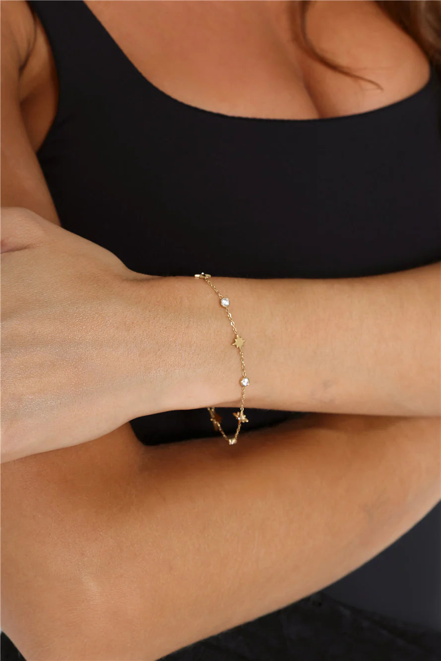 Gold Star Charm Bracelet with Sparkling Diamantes for Festive Glamour