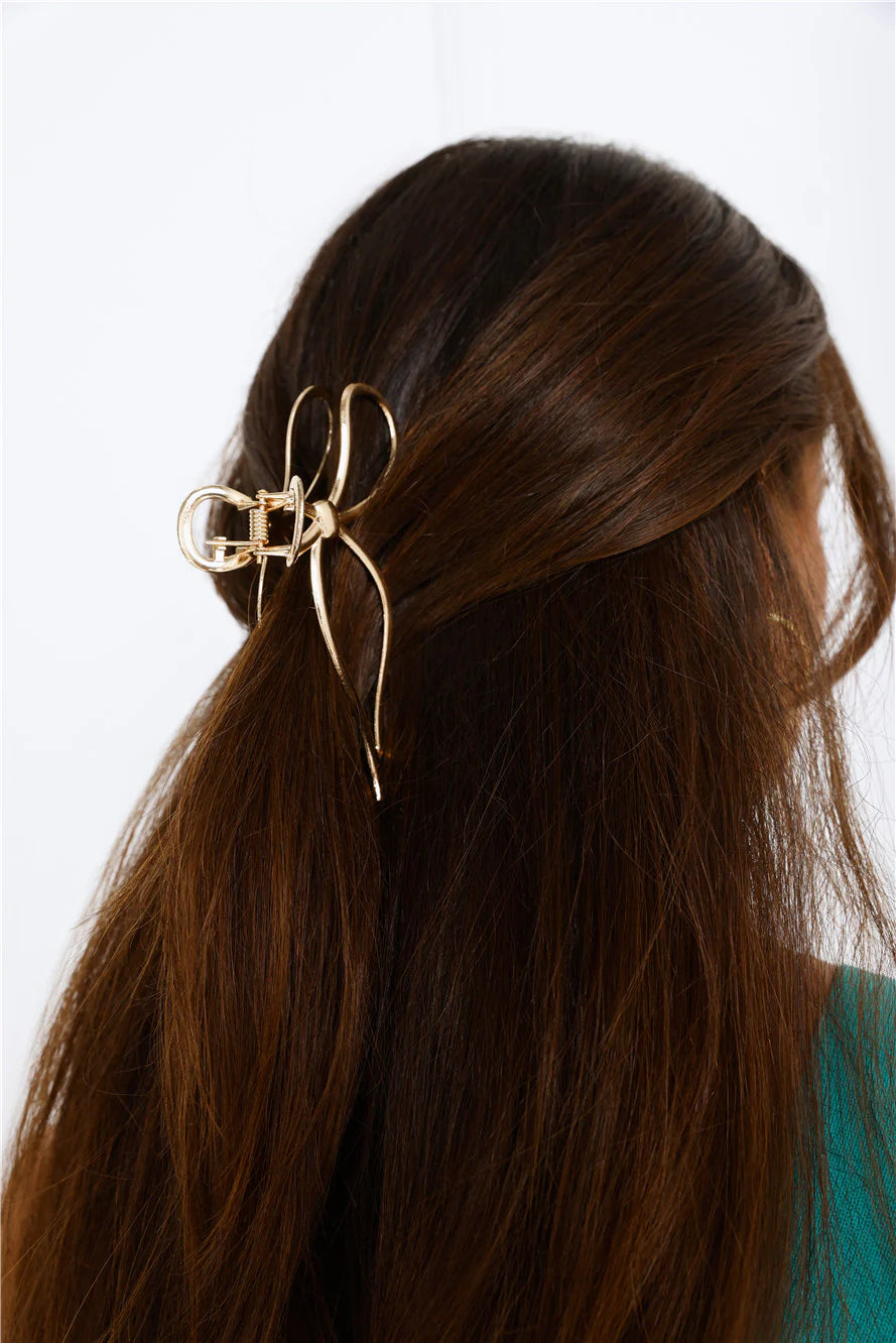 Gold Bow Claw Clip for a Romantic and Effortless Hairstyle